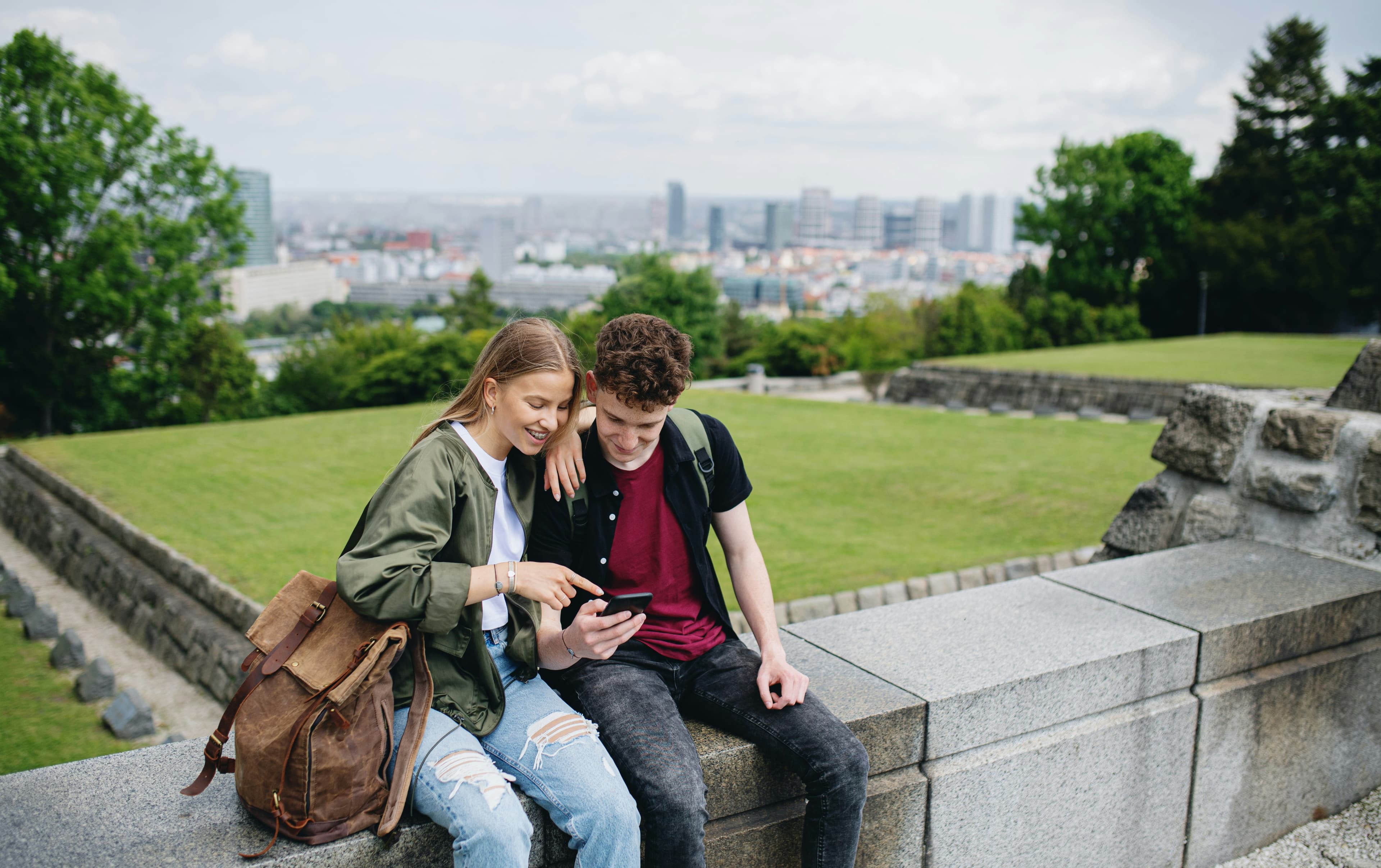 Two people looking at a phone together